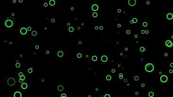 Green circle particle motion background. Faded wallpaper animation with black color. Flying bubble. video