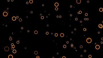 fondo de movimiento de partículas de círculo naranja. animación de papel tapiz descolorida con color negro. burbuja voladora. video