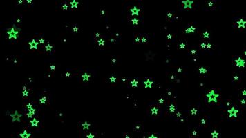 groene ster deeltje beweging achtergrond. vervaagde achtergrondanimatie met zwarte kleur. vliegende bubbel. video