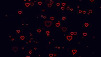 Red heart particle motion background. Faded wallpaper animation with black color. Flying bubble.