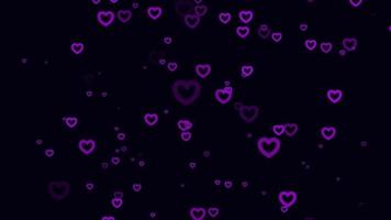 sfondo di movimento delle particelle di cuore viola. animazione dello sfondo sbiadito con colore nero. bolla volante. video