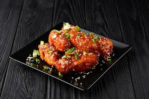 Korean fried chicken with black backdrop. photo