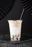 Taiwan milk tea with bubble on wood background photo