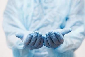 Close up of doctor hand holding. Mock up. Medical equipment. A doctor wearing personal protective equipment to protect COVID 19 coronavirus infection. photo