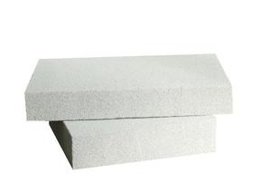 Lightweight construction brick isolated on white. Lightweight foamed gypsum block isolated on white. photo