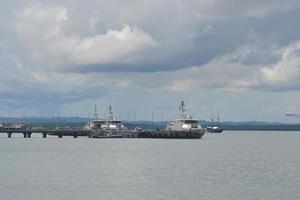 Sorong, West Papua, Indonesia, September 30th 2021. Naval patrol boats mooring at the dock. photo