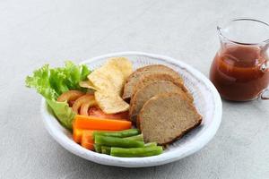 Selat solo galantin is a traditional Javanese dish that has European influences and originates from Solo, Central Java. Consisting of meat and vegetables. photo