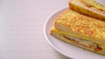 Homemade French toast ham bacon cheese sandwich with egg video