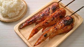 grilled or barbecue chicken wings skewer with sticky rice video