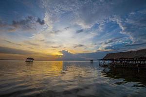 Pontoon floating in the water at sunset photo