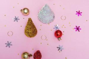 Flat christmas mockup with new year decor on pink background, copy space photo