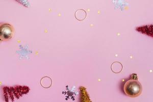 Flat christmas mockup with new year decor on pink background, copy space photo