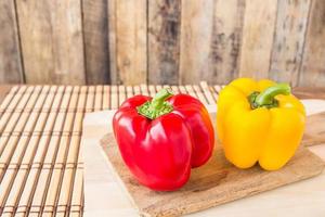 Sweet red and yellow pepper in wooden cutting boards