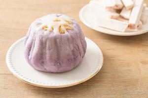 taro bun with white sugar cream and nut photo