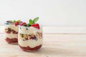 homemade raspberry and blueberry with yogurt and granola photo