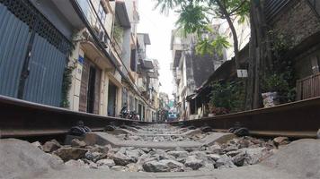 4K Real-time video Sequence of Hanoi, Vietnam - Super wide angle view under the train passing the streets of Hanoi