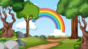 escena del bosque natural con arco iris en el cielo