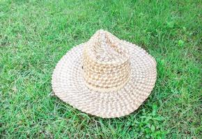 Beautiful straw hat in the green grass photo
