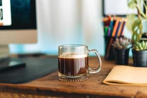 black coffee in a mug on the desk photo