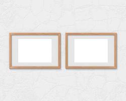 Set of 2 horizontal wooden frames mockup with a border hanging on the wall. Empty base for picture or text. 3D rendering. photo