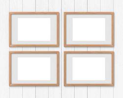 Set of 4 horizontal wooden frames mockup with a border hanging on the wall. Empty base for picture or text. 3D rendering. photo