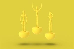 tres hombres de juguete de color amarillo sobre un pedestal abstracto deportivo. foto