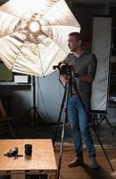 photographer in the process of shooting in the Studio photo