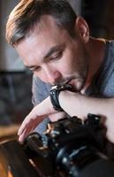 portrait of photographer with camera in Studio photo