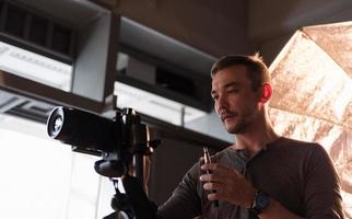 photographer in the process of shooting in the Studio photo