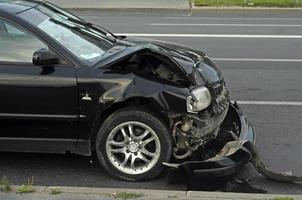 The front part of the car that was broken in the accident on highway photo