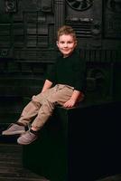 portrait of stylish cute little boy in photo studio