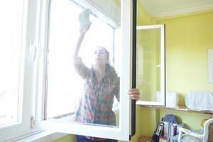 Forty Eight Year Old Woman Washing the Windows photo