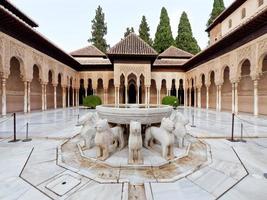 Granada, Spain, 31.08.2021. Patio of the Lions, Nasrid Palaces, Alhambra. Moorish Architecture. Unesco World Heritage Spain. Travel in time and discover history. Amazing destinations for holidays. photo