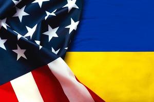 American flag and National flag of Ukraine background photo