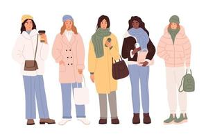 A set of characters. Young women in winter clothes vector