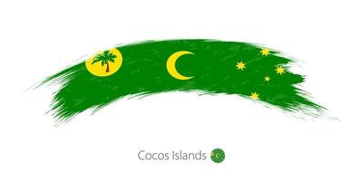 Flag of Cocos Islands in rounded grunge brush stroke. vector