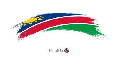 Flag of Namibia in rounded grunge brush stroke. vector