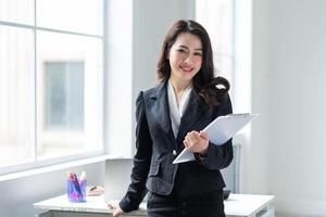 Young Asian businesswoman working at office photo