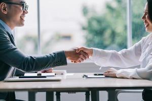 Asian male director is interviewing to recruit new employees photo