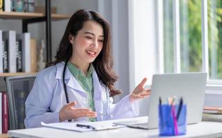 Image of Asian female doctor working at clinic photo