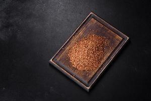 Bio buckwheat cereals raw food background, texture close up photo