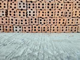 stack of bricks red wall background photo