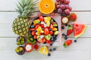 fresh fruit salad bowl - healthy food summer fruit and berries photo