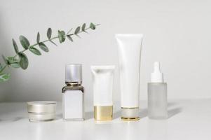 moisturizing cream bottle over leaf background studio, packing and skincare beauty concept photo