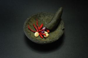 Cobek or Ulekan is a pair of tools that have been used since ancient times to pound, grind, pulverize, grind, and mix certain ingredients. photo