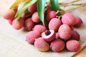 Fresh lychee wooden table from tree tropical fruit summer in Thailand photo