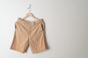 short pants hanging on wall photo