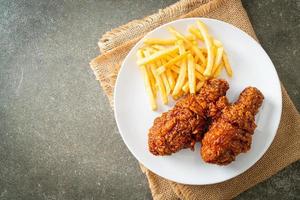 spicy Korean fried chicken with fries photo