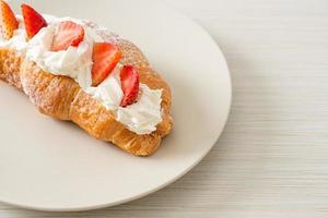 strawberry fresh cream croissant on plate photo