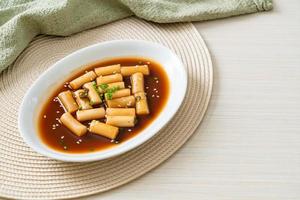 Spicy Jjajang Tteokbokki or Korean rice cake in spicy black bean sauce photo